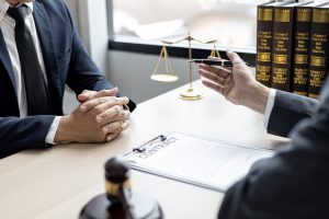 A solicitor discusses assaulted at work compensation with a client. 