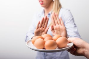 A woman with a food allergy who can't eat eggs