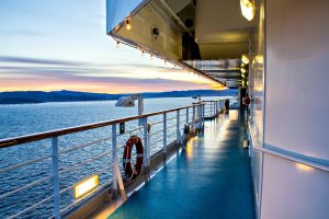 A cruise ship walkway lit by the sunset