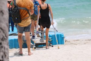 Injured passengers arrive at a floating dock to board a cruise line